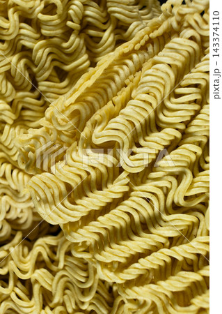 Detailed texture of raw wavy instant ramen noodle block Detailed texture of raw wavy instant ramen noodle block 143374110