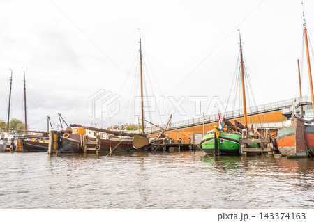 Boats Moored in a Harbor 143374163