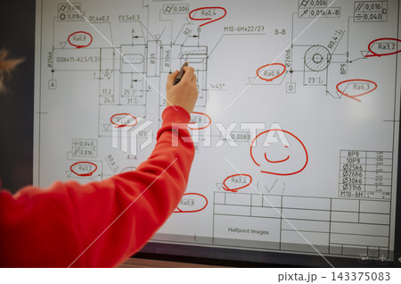 Teen student working together on interactive digital board at school. 143375083