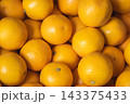 Heap of fresh ripe oranges in the grocery store shelf or local market 143375433