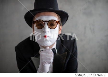 Close up portrait of a sad male mime wearing double glasses Close up portrait of a sad male mime wearing double glasses 143376027