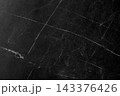 Textured background with a pattern made of black marble. 143376426