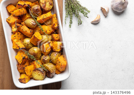 Autumn meal: oven roasted seasonal vegetables with garlic and herbs Autumn meal: oven roasted seasonal vegetables with garlic and herbs 143376496