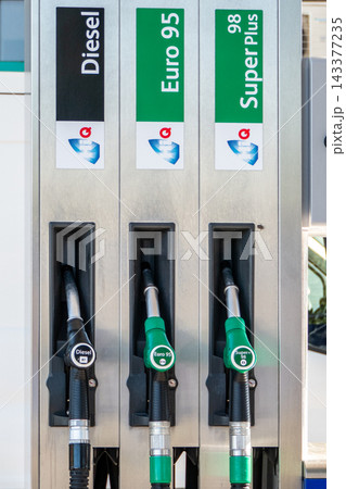 Fuel pumps with different types of petrol and diesel at a European gas station Fuel pumps with different types of petrol and diesel at a European gas station 143377235