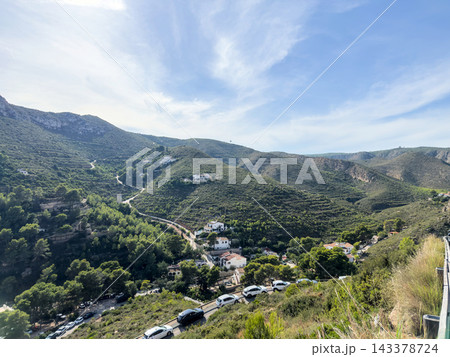 Green hills and villas in valley near Granadella with cars on road, Javea 143378724