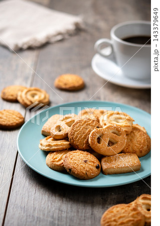 Assorted butter cookies on plate with cup of coffee 143379649