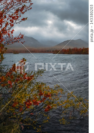 Climate Change Concept with Severe Weather Over Arctic Mountain Lake Climate Change Concept with Severe Weather Over Arctic Mountain Lake 143380203