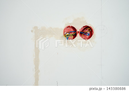 Electrical wires in wall boxes ready for outlet installation 143380886