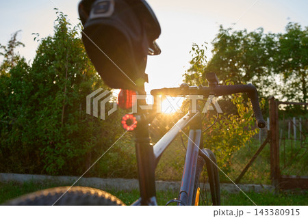 Rear view of gravel bike at sunset 143380915