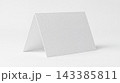Blank white folded greeting card on a plain background with greeting stationery invitation template minimalist background paperwork correspondence announcement cardstock material creative branding 143385811