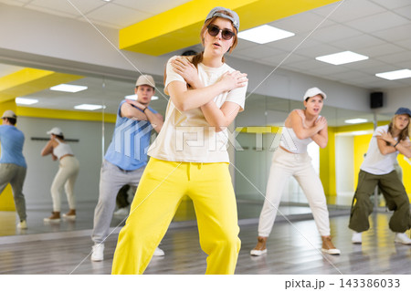 Active teens learn new dance moves in studio Active teens learn new dance moves in studio 143386033