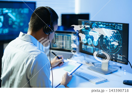 Professional analyzing data on digital screens in a modern workspace, featuring technology, dashboard, monitoring, computer systems, analytics and aviation data. Professional analyzing data on digital screens in a modern workspace, featuring technology, dashboard, monitoring, computer systems, analytics and aviation data. 143390718