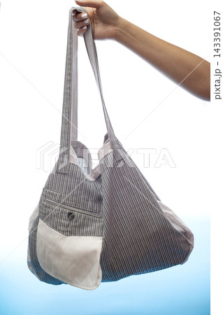 Reusable grocery Eco Bag made of natural fabrics on a white background Reusable grocery Eco Bag made of natural fabrics on a white background 143391067