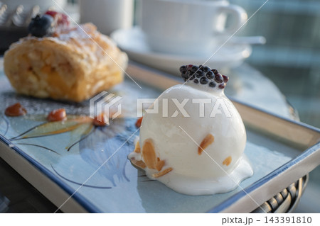 Gourmet mousse cake and puff pastry desserts served on a tray in a luxury cafe 143391810