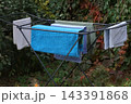 colorful clothespins on a pole with an orange sky 143391868
