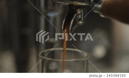 Closeup shot of pulling an espresso shot from coffee machine 143394193