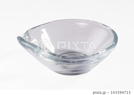 White background empty clear glass bowl with pouring spout and smooth transparent surface kitchenware White background empty clear glass bowl with pouring spout and smooth transparent surface kitchenware 143394713