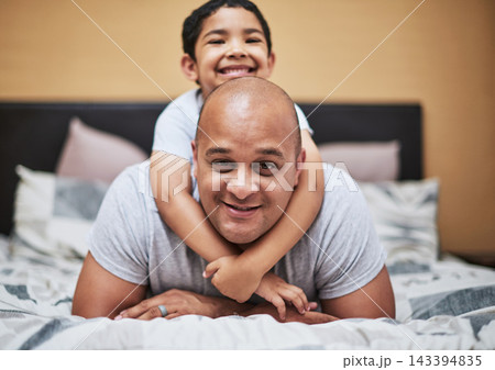 Portrait, father and son with love in bedroom for bonding with smile, family and home for development. Trust, people and caring with role model in house for nurturing with positive relationship. 143394835