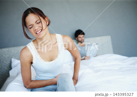 Upset, couple and annoyed woman in bedroom for problem, fight or erectile dysfunction, Newspaper, bored and female person with husband for frustrated, disappointed or relationship argument in home 143395327