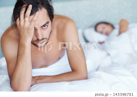 Man, depressed and bed with portrait for stress, headache or toxic relationship at home. Mental health, sad person or woman asleep for disagreement, anger and conflict of insomnia, anxiety or crisis Man, depressed and bed with portrait for stress, headache or toxic relationship at home. Mental health, sad person or woman asleep for disagreement, anger and conflict of insomnia, anxiety or crisis 143396781