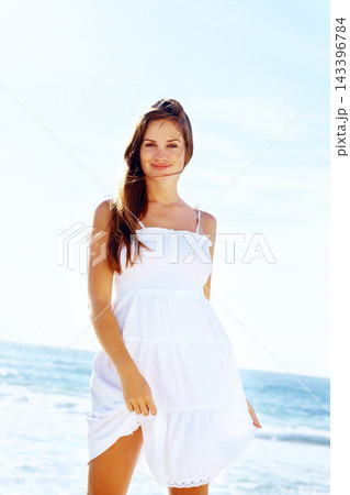 Portrait, ocean or woman on holiday to relax on vacation adventure in outdoor break or paradise in Ibiza. Smile, island or girl with confidence at beach, nature or sea with peace, wellness or travel 143396784