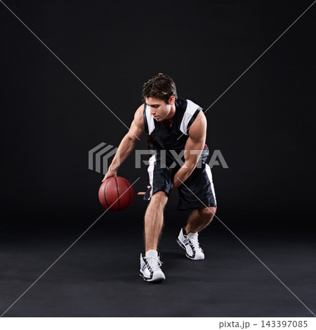 Basketball, dribbling and man in dark studio for sports, fitness exercise or training for strong body. Male athlete, black background and workout for game in gym, night with health and wellness Basketball, dribbling and man in dark studio for sports, fitness exercise or training for strong body. Male athlete, black background and workout for game in gym, night with health and wellness 143397085