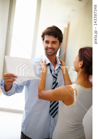 Dressing, woman and man in morning for work with reading, paper or business trip for presentation. Happy couple, helping and excited in preparation for day at office as employee in corporate job 143397349