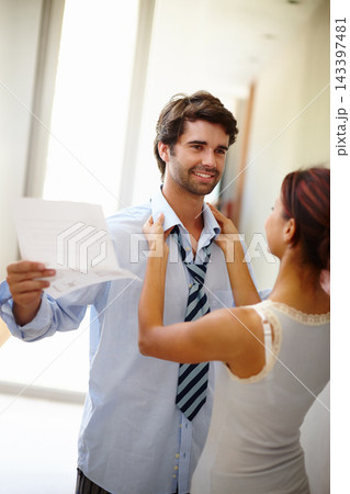 Dressing, happy and couple in morning for work with reading, paper or business trip for presentation. Woman, man and helping with excited in preparation for day at office as employee in corporate job 143397481