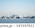 Boats in Mumbai Harbor with blue sky background, Maharashtra, India 143397831