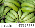 Organic green fresh unripe bananas, harvested tropical fruit green background, closeup 143397833