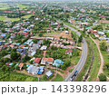 Aerial View of Rural Residential Area with Curving Road and Green Landscape 143398296