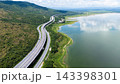 Drone shot The M6 motorway Nakhon Ratchasima Province - Bang Pa-in Lam Ta Khong River and Mountain. Motorway Korat Thailand 143398301