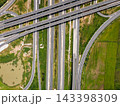 Drone shot a large highway interchange crossing over green farmlands in Thailand 143398309