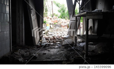 View to destroyed residential buildings at Kharkivska oblast. Ruined houses after bomb attacks on ukrainian territory from russia army. Consequences of russian invasion of Ukraine. Slow motion 143399096