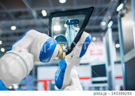 Industrial Robot Arms Assembling Car Window in Smart Factory Industrial Robot Arms Assembling Car Window in Smart Factory 143399293