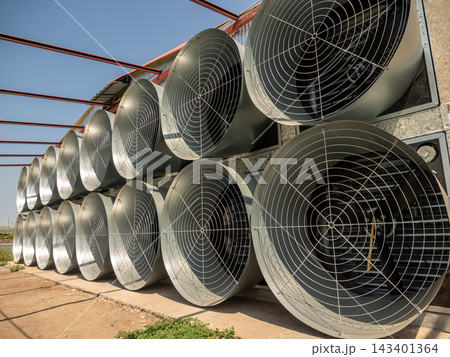 A row of exhaust fans from the livestock house A row of exhaust fans from the livestock house 143401364