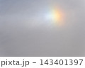 Rainbow flare light phenomenon in the daytime sky 143401397