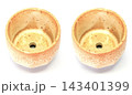The ceramic cup has been adapted for planting small pot plants 143401399