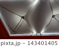 It was located in a large hall, under a clean white canvas roof, with beautiful lighting 143401405