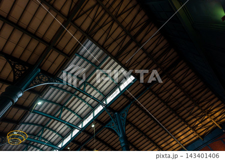 View up from the large hall, the steel frame of a large curved roof View up from the large hall, the steel frame of a large curved roof 143401406