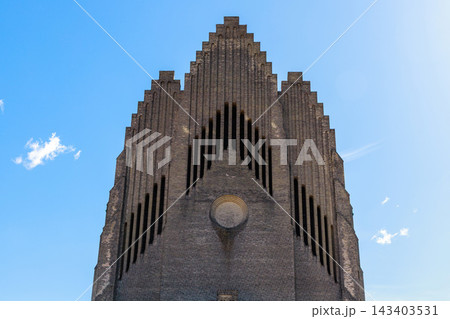 Grundtvig Church minimalist architecture with geometric symmetry and iconic brick design in Copenhagen Denmark. 143403531