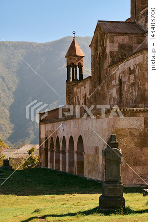 Side view of Odzun Church with stone stele and mountains, Lori Province, Armenia 143403700