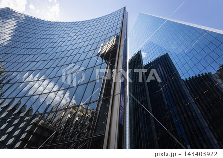 Curved glass facade of modern skyscraper Curved glass facade of modern skyscraper 143403922
