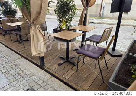 Charming Street Cafe Patio for Outdoor Dining and Relaxation 143404339