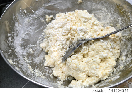 Homemade Dough Preparation in Stainless Steel Bowl for Baking and Cooking Homemade Dough Preparation in Stainless Steel Bowl for Baking and Cooking 143404351