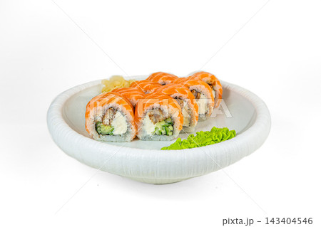 Sushi roll topped with salmon, filled with eel, cream cheese and cucumber, with wasabi and ginger on white plate, white background Sushi roll topped with salmon, filled with eel, cream cheese and cucumber, with wasabi and ginger on white plate, white background 143404546