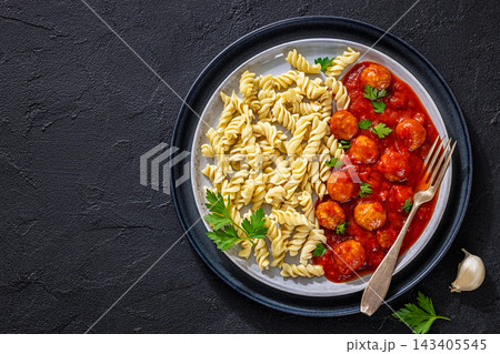 Meatballs in rich marinara sauce and fusilli pasta Meatballs in rich marinara sauce and fusilli pasta 143405545