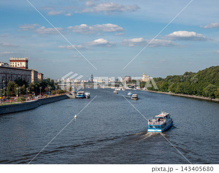 10 August 2026 Russia Moscow view from Andreevsky Bridge toward Krymsky Bridge with boats sailing along the Moskva River and urban waterfront 143405680