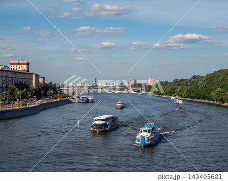 10 August 2026 Russia Moscow view from Andreevsky Bridge toward Krymsky Bridge with boats sailing along the Moskva River and urban waterfront 10 August 2026 Russia Moscow view from Andreevsky Bridge toward Krymsky Bridge with boats sailing along the Moskva River and urban waterfront 143405681