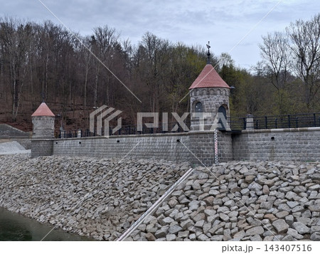 Serene countryside at dusk. Quiet natural setting with historic structures under overcast evening sky Serene countryside at dusk. Quiet natural setting with historic structures under overcast evening sky 143407516